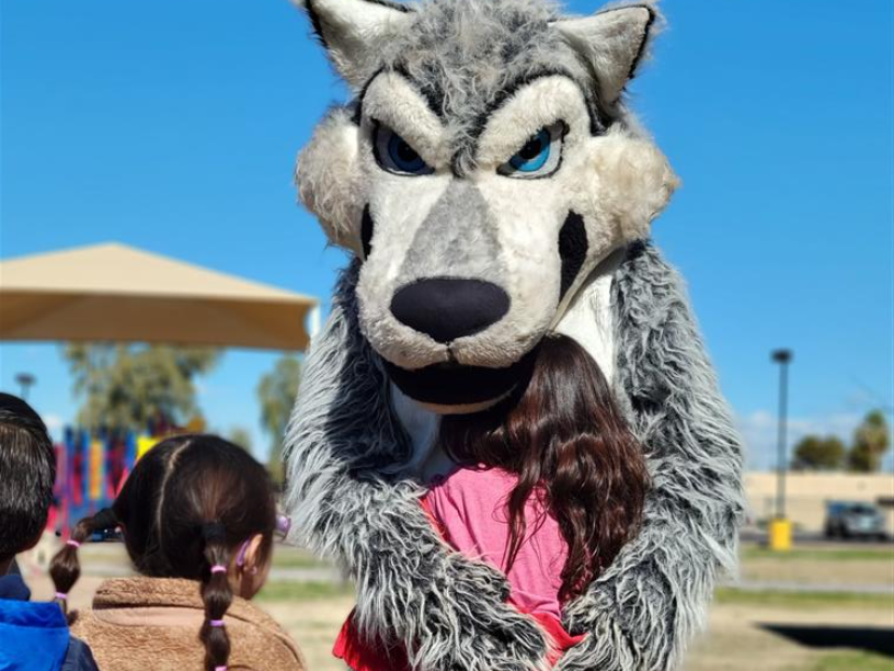 Scruffy the Chandler High Mascot with students.